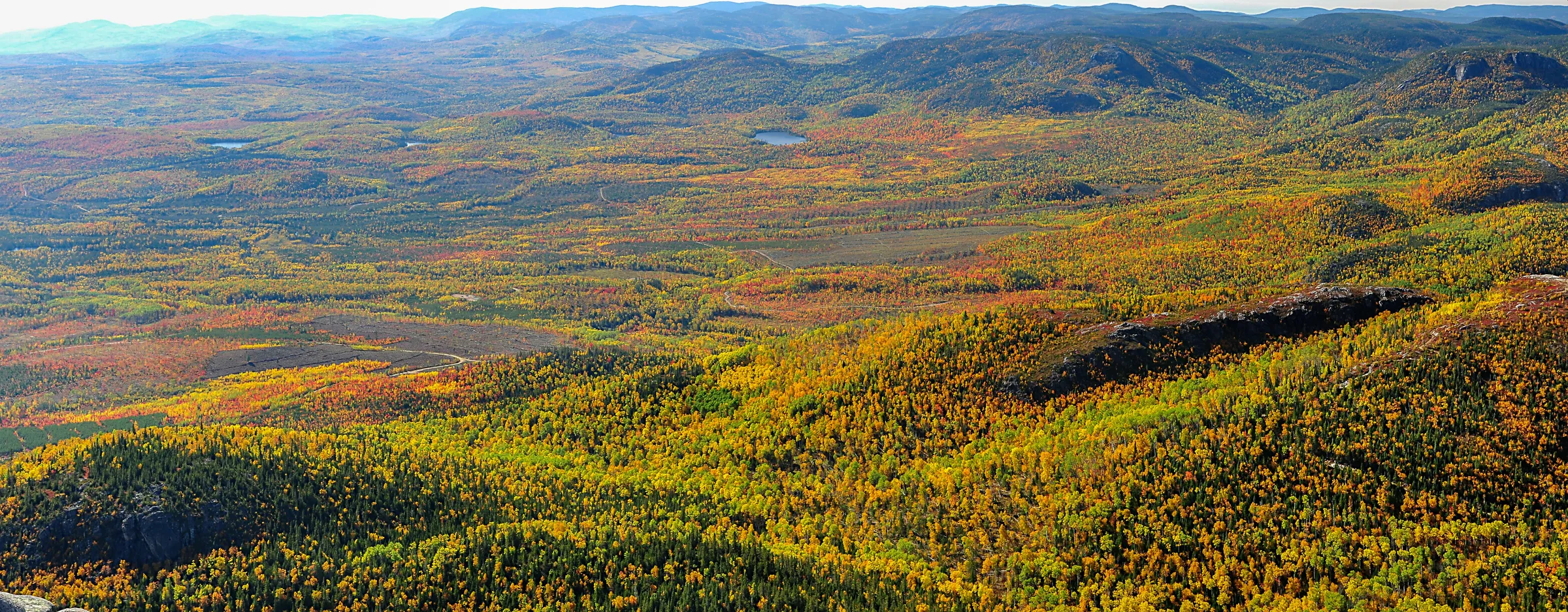 An aerial view of a mountain range with a river running through it