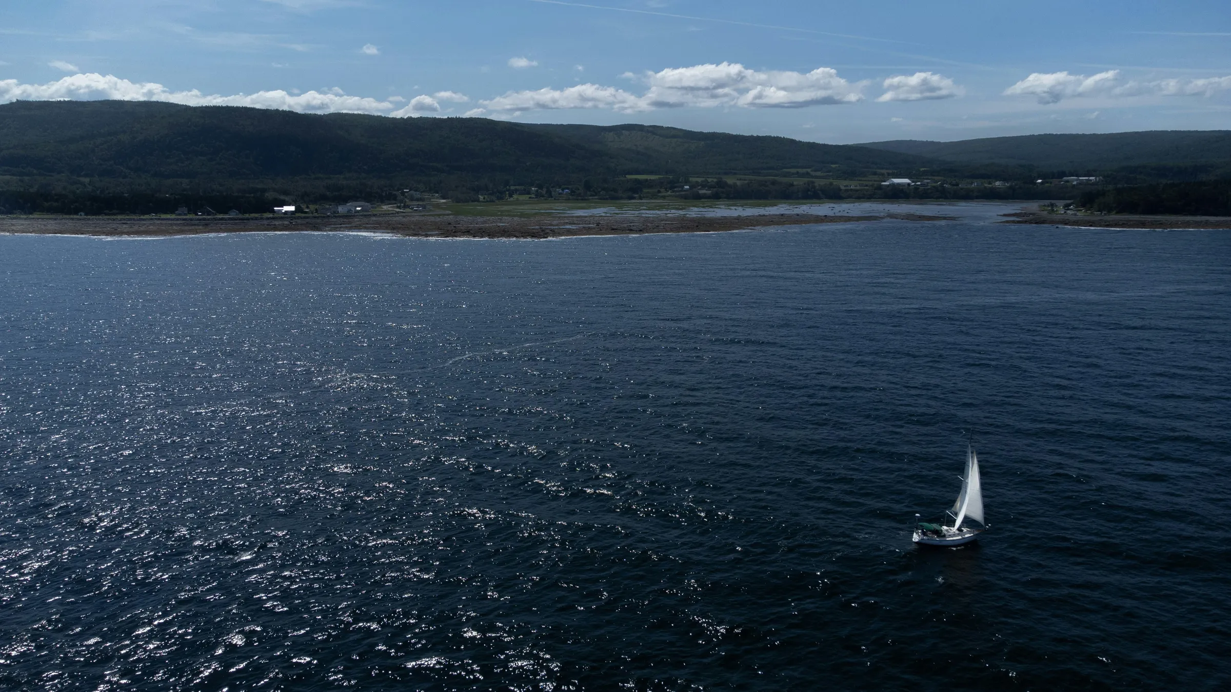 a sailboat in the middle of a large body of water