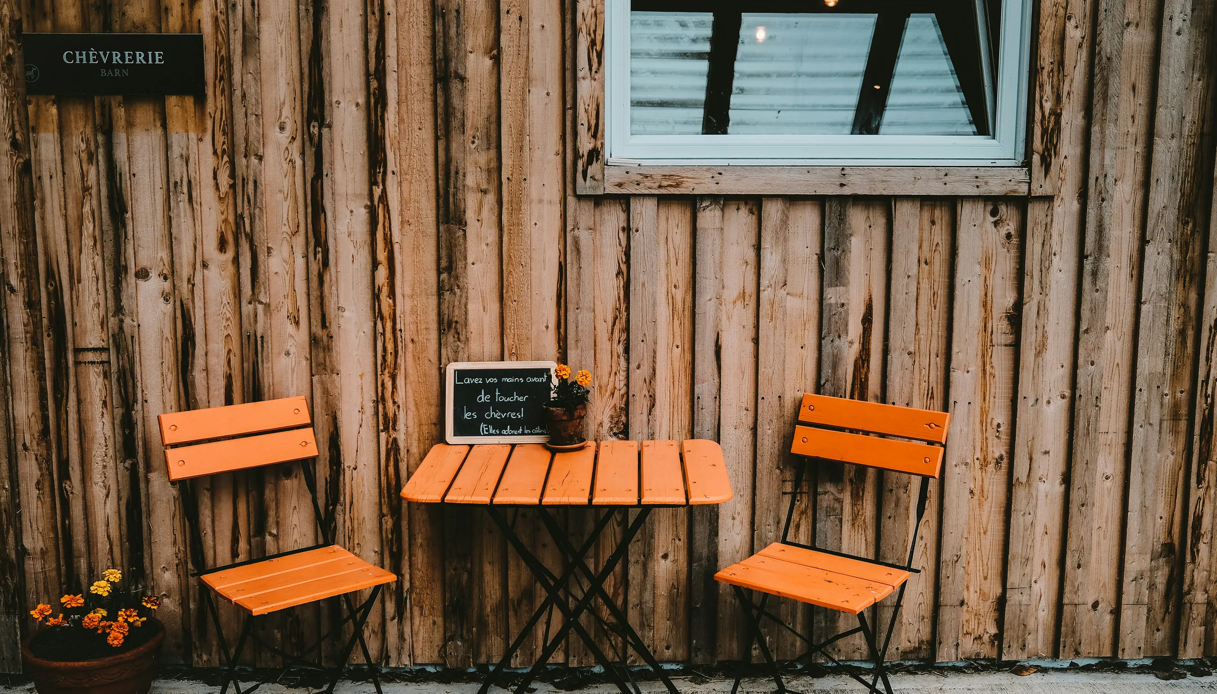 black laptop computer on brown wooden table